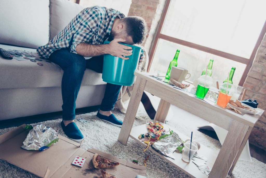 man with alcohol poisoning vomiting as a result
