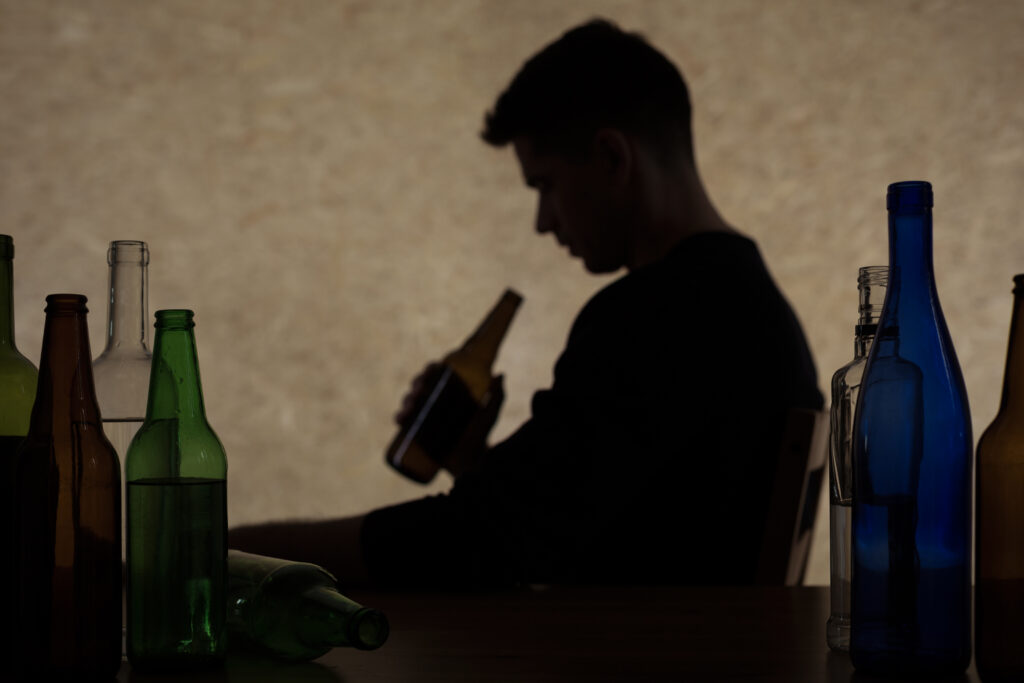 man having alcohol use disorders and mental health issues