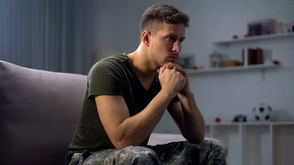 Upset soldier remembering terrifying war, suffering ptsd, psychological help mental health care patient suffering from PTSD