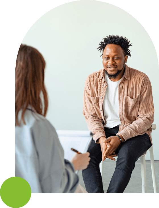 man talking to therapist in rehab covered by blue cross blue shield