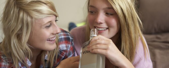 Two Teenage Girls Drinking Alcohol