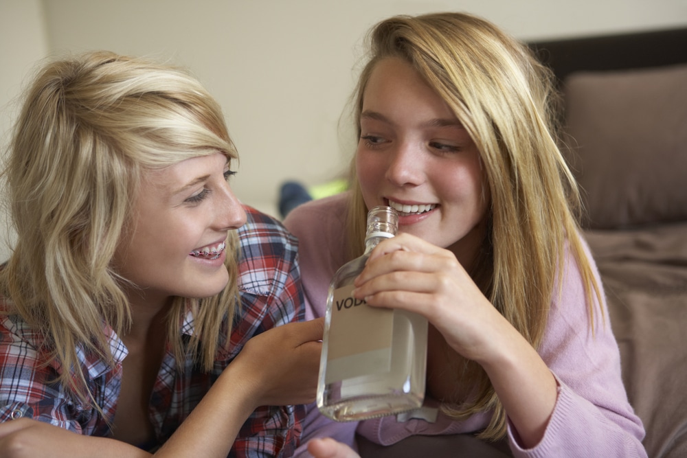 Two Teenage Girls Drinking Alcohol
