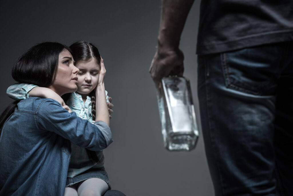 women protecting daughter from the effects of alcoholism on families
