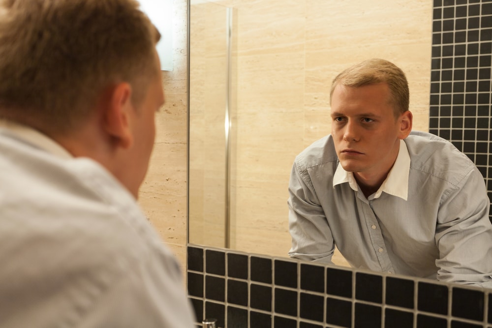 relapse prevention plan template for alcohol abuse - man looking at the mirror 