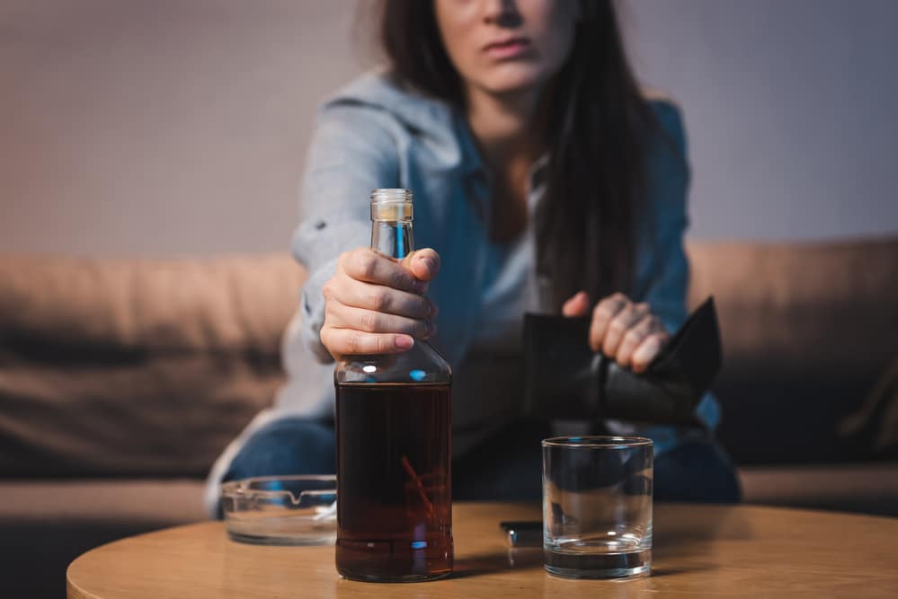 woman choosing alcohol over relationship