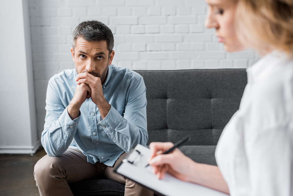 mental health professional doing psychotherapy with patient