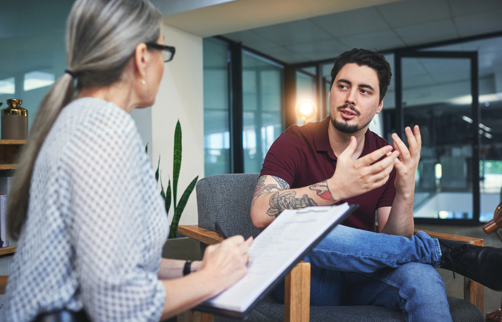 patient having personalized individual therapy session with mental health professional