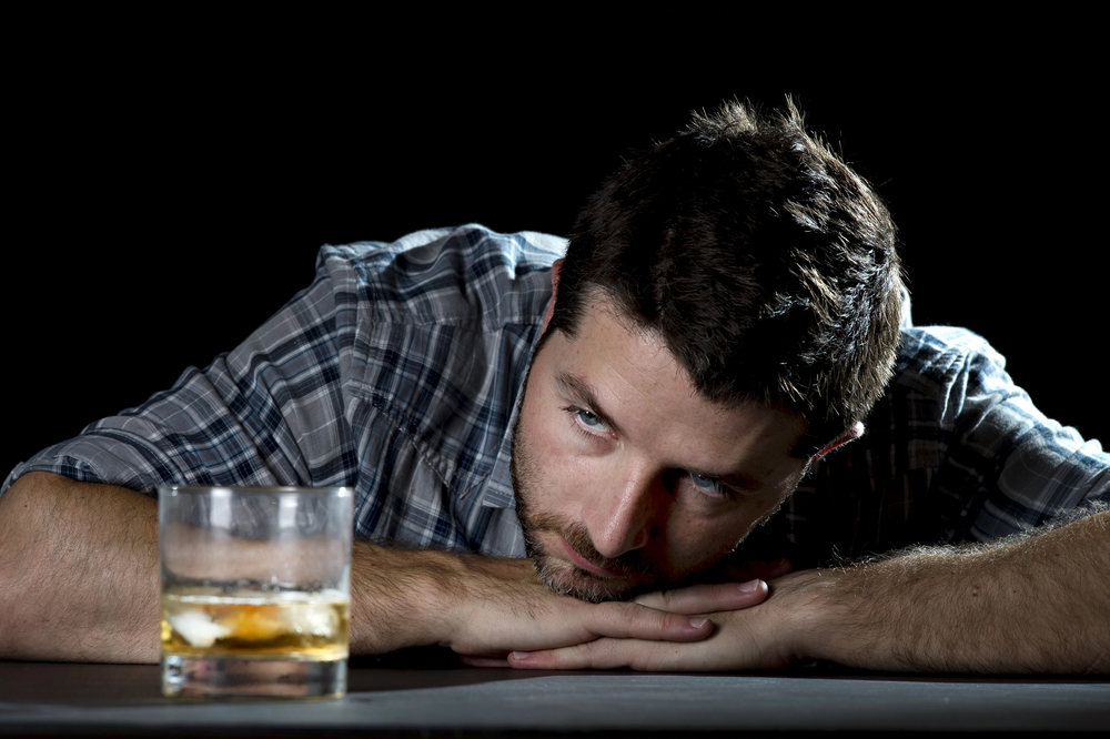 Alcoholic addict man drunk with whiskey glass, showing alcoholism