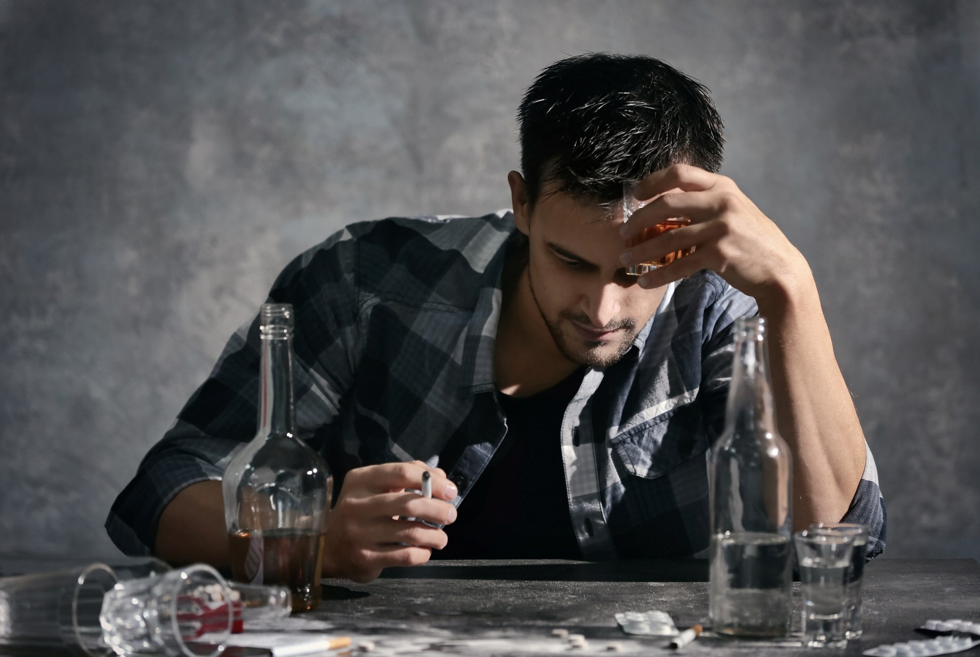 Man in alcohol and drug addiction-min