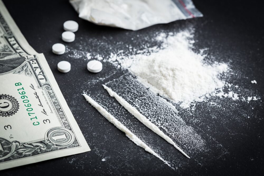 image representing snorting cocaine, money and pills