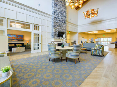 a very spacious and pleasant lobby with plenty of sunlight and seating.