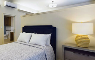 a peaceful bedroom, hallway, and bathroom