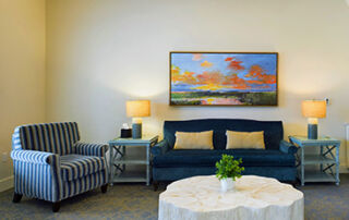 a cozy room with 2 couches and a white table