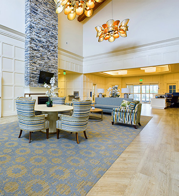 a very spacious and pleasant lobby with plenty of sunlight and seating.